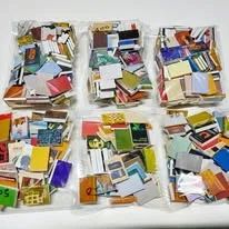 Hundreds of printed books, bagged by set